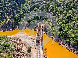 The Salomon Bridge crossing the red river, Rio Tinto, is a railway bridge in the province of Huelva and was originally part of the photo