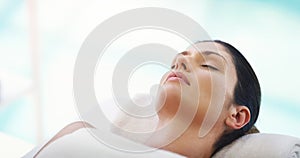 Salon, beauty and woman relax at spa for massage, facial treatment and luxury pamper. Aesthetic, skincare and person photo