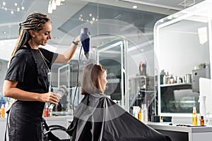 salon blow dry, happy hairdresser with
