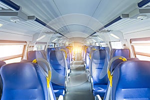 Salon inside of the speed commuter train with empty seats.