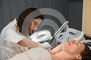 Salon procedure of electrolysis armpit hair remove