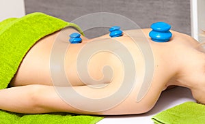 Salon. Woman getting spa cupping vacuum massage photo
