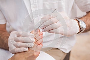 Salon worker with customers foot