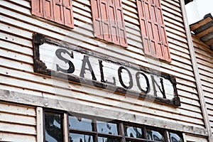 Saloon sign on building facade