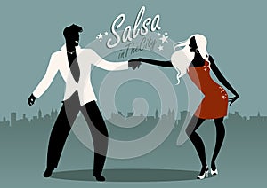 Salsa in the City. Silhouettes of young couple dancing latin music photo