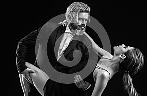 Salsa dancing couple. Young luxury pair dance isolated on black background. Romantic.