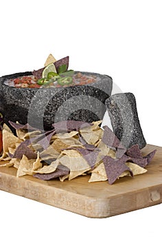 Salsa in Molcajete with blue chips