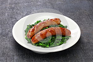 Salsiccia e cime di rapa, sausage and braised tunip greens photo