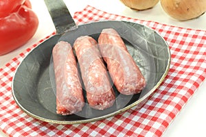 Salsiccia in a pan on napkin photo