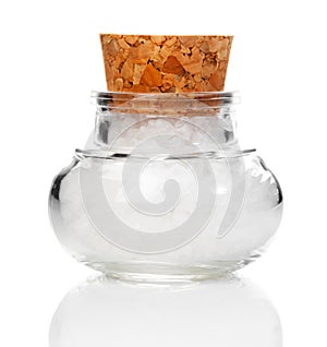 Salt in the cork jar, on white