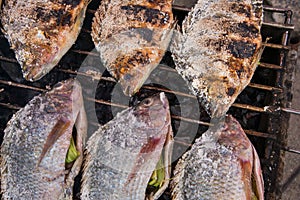 Salt-Crusted Grilled Fish in the local market of Thailand