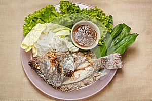 Salt-Crusted Grilled Fish and mix vegetable on plate