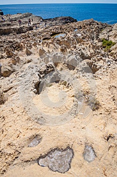 Salt crystallizes on the rocks at the Azure Window.