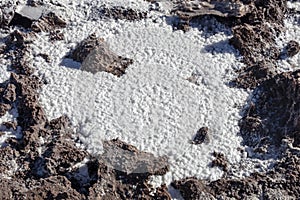 Salt crystals on the salty surface of desert close up. Natural background with copy space