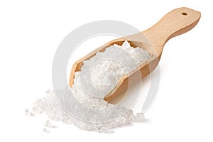 Salt crystals in a wooden scoop isolated on white background