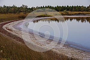 Salt evaporation lake shores. An industrial salt plant produces - natural sea salt