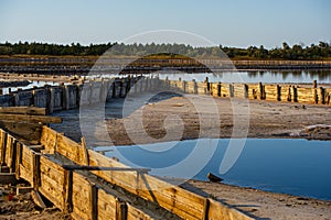 Salt evaporation lake shores. An industrial salt plant produces - natural sea salt