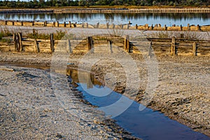 Salt evaporation lake shores. An industrial salt plant produces - natural sea salt