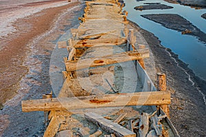 Salt evaporation lake shores. An industrial salt plant produces - natural sea salt