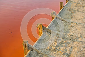 Salt evaporation lake shores. An industrial salt plant produces - natural sea salt