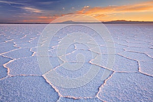 Salt flat Salar de Uyuni in Bolivia at sunrise