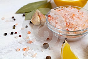 Salt and lemon.close-up Pink Himalayan salt on the glass bowl