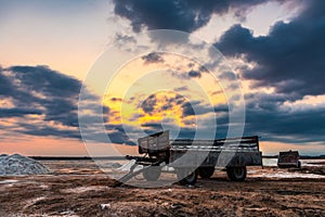 Salt mining on dry lake during sunset