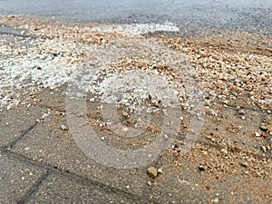 Salt on the pavement to melt snow, cleaning streets in winter