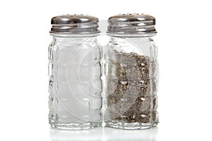 Salt and pepper shakers on white