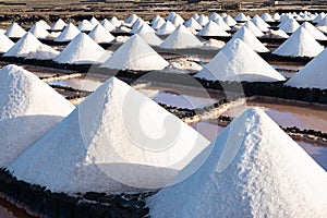 Salt piles on a saline exploration in salt factory refinery mines Janubio, Lanzarote, Canary Islands, Spain