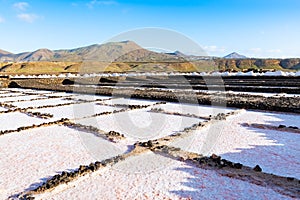 Salt piles on a saline exploration in salt factory refinery mines Janubio, Lanzarote, Canary Islands, Spain