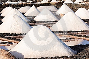 Salt piles on a saline exploration in salt factory refinery mines Janubio, Lanzarote, Canary Islands, Spain