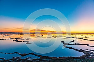 Salt ponds at sunset in Ba