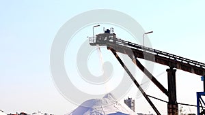 Salt production, conveyor belt with marine salt produced by the evaporation of seawater