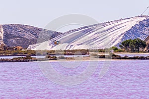 Salt production, pink lagoon and hills in the Mediterranean sea is located in Aigues-Mortes . Camargue, France. Hight