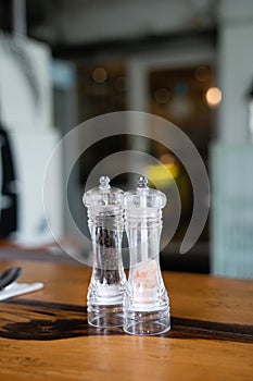 Salt shaker and pepper shaker on the table