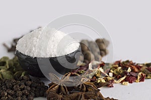 Salt with spices on white background.