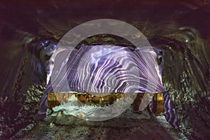 Salt wall with quaint ornaments in Salina Turda salt mine, Romania