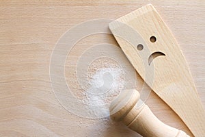 Salt with wooden spoon on cutting board, unhealthy food additives concept