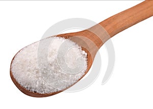 Salt in a wooden spoon on a white