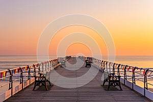 Saltburn pier and a golden sunrise. North Yorkshire.