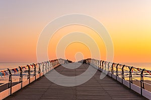 Saltburn pier and a golden sunrise. North Yorkshire.