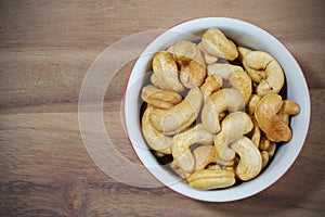 salted cashew nut on wooden background