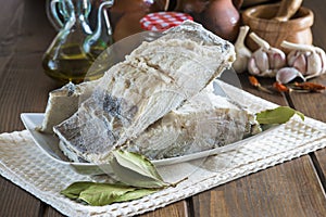 Salted cod cut on the table of the kitchen