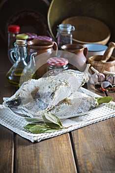Salted cod cut on the table of the kitchen