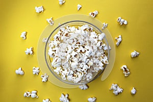 Salted crispy popcorn lies on a glass plate