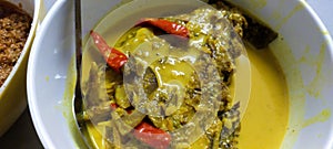 Salted fish cooked with santan and tumeric