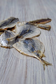 Salted fish lying on a wooden table