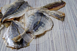 Salted fish lying on a wooden table