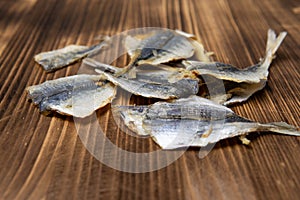 Salted fish lying on a wooden table